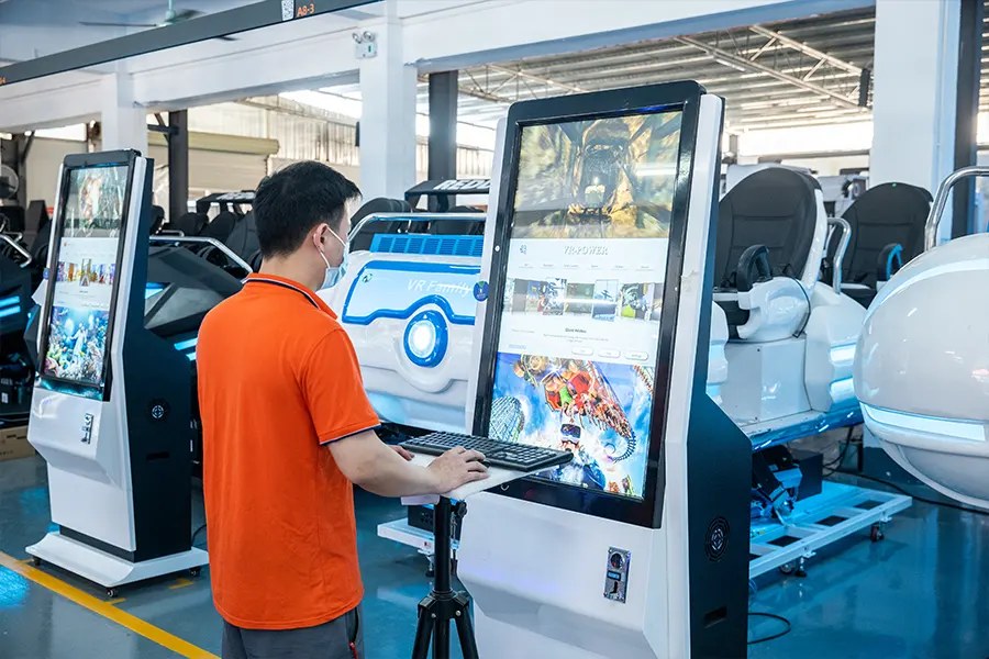 a worker inspecting the VR  arcade machine