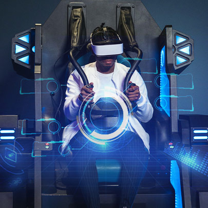 a man sitting in the VR flight simulator