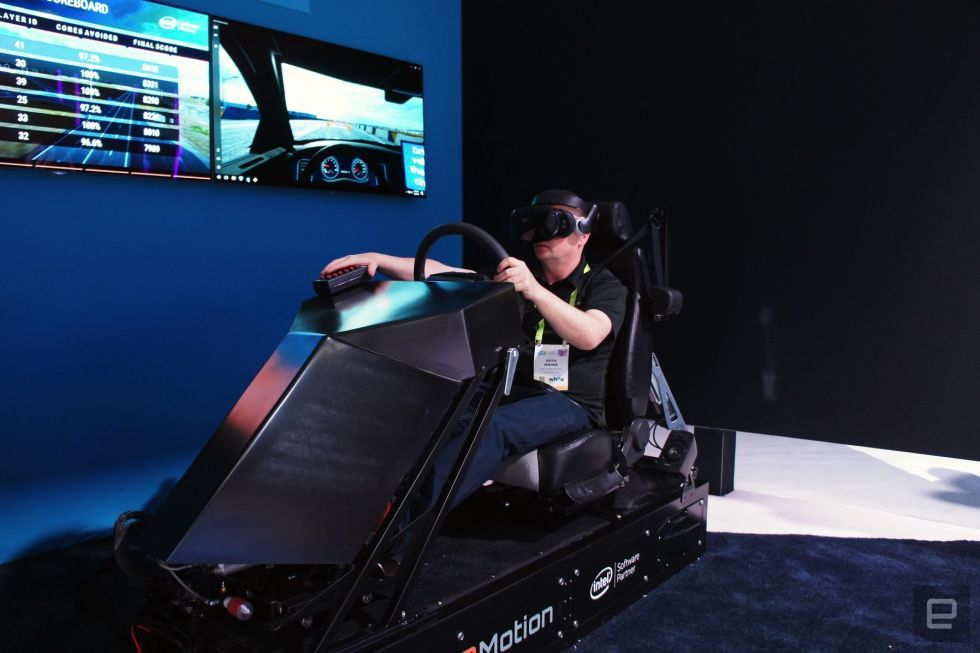 a man playing the game with car racing simulator